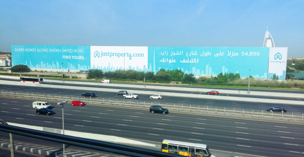 JustProperty.com large billboard ad next to the Mall of the Emirates